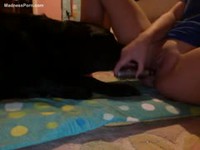 Horny nineteen year old masturbating while her dog licks her cunt